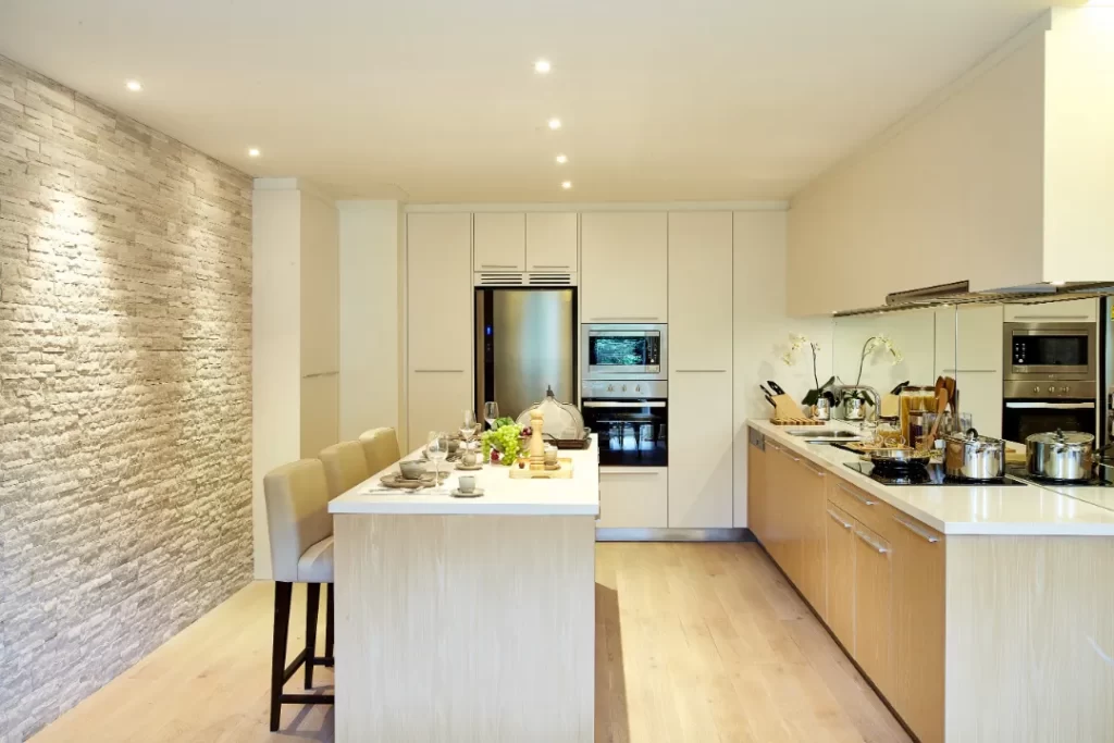 Modern kitchen interior with recessed ceiling lights, showcasing professional electrical lighting installation by Sunshine Coast electricians in Buderim.
