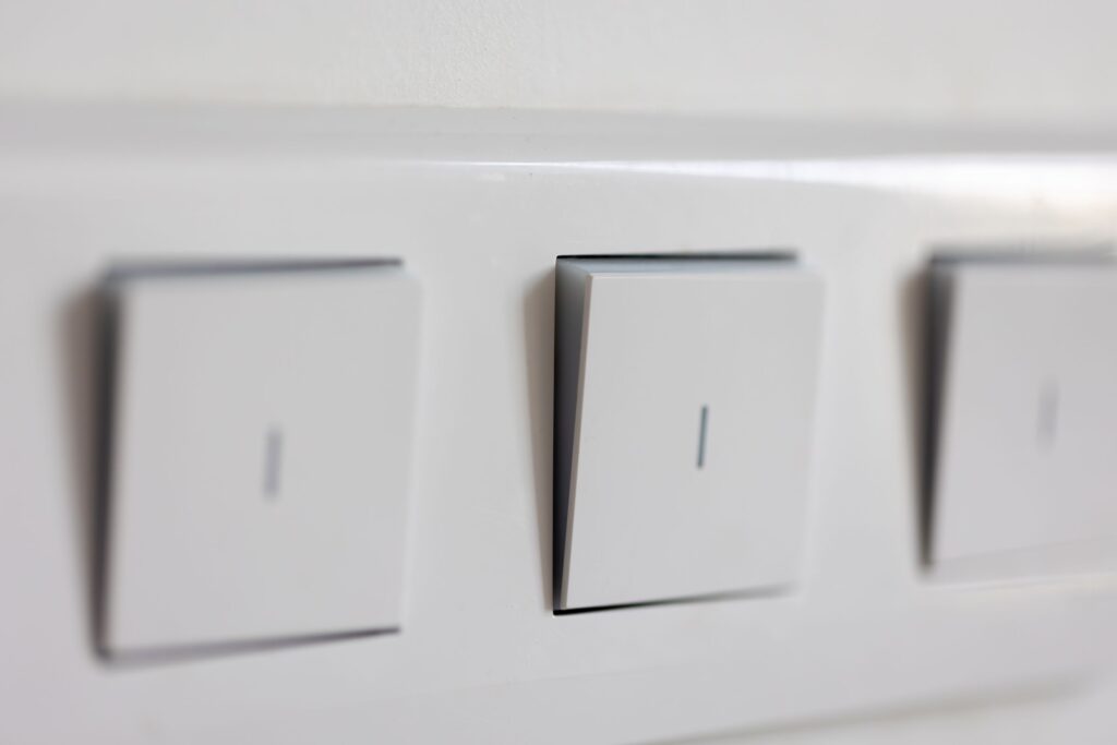 Close-up of electrical safety switches (RCDs) in a modern household switchboard on the Sunshine Coast