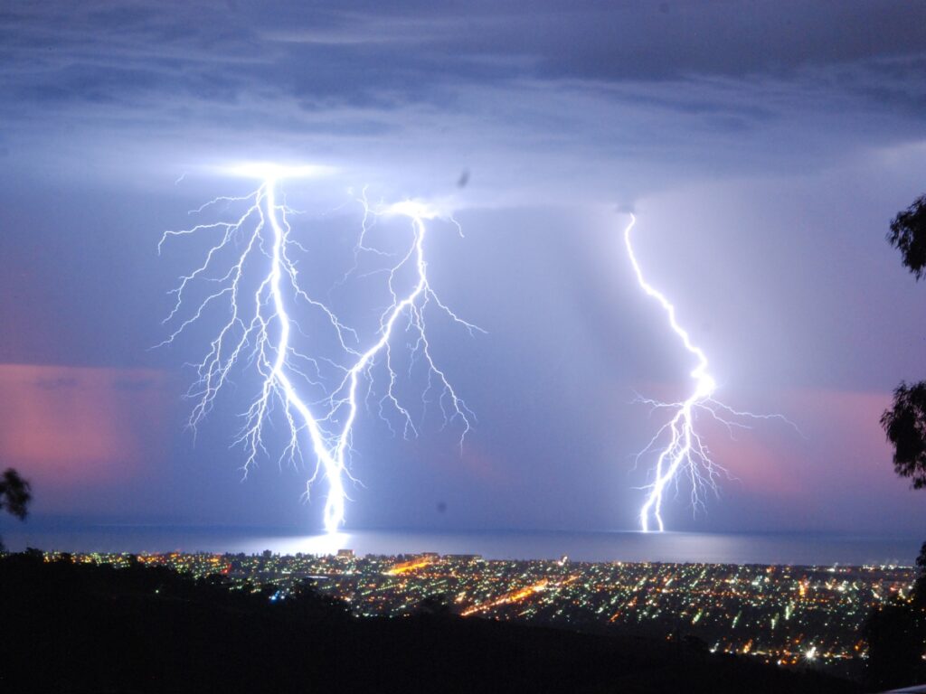 Uprooted tree and storm damage at a residential property on the Sunshine Coast during storm season, highlighting electrical hazards.